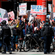 Protestors against the coronavirus shutdown in front of a James R. Thompson Center on May 1, 2020 in Chicago